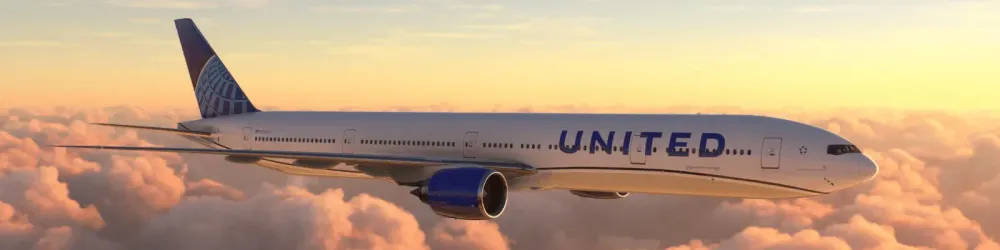 Boeing 777 United Airlines flying over amazing sunset